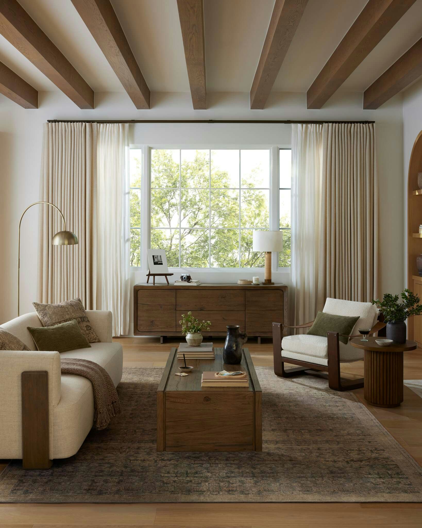 Living room shot featuring Hudson Cradle Sofa, Cassius Sling Chair, Hargrove Coffee Table and Yasina Rug