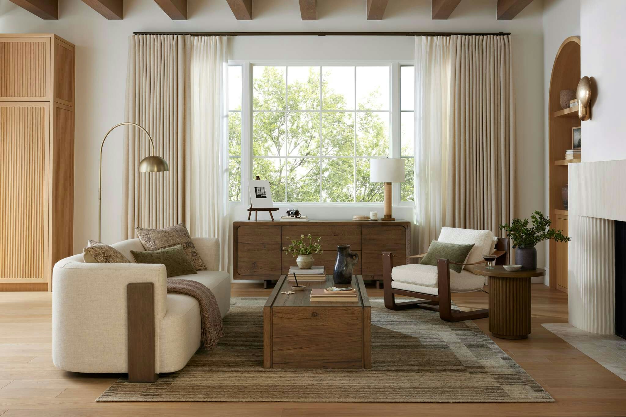 Living room shot featuring Hudson Cradle Sofa, Cassius Sling Chair, Hargrove Coffee Table and Anala Rug