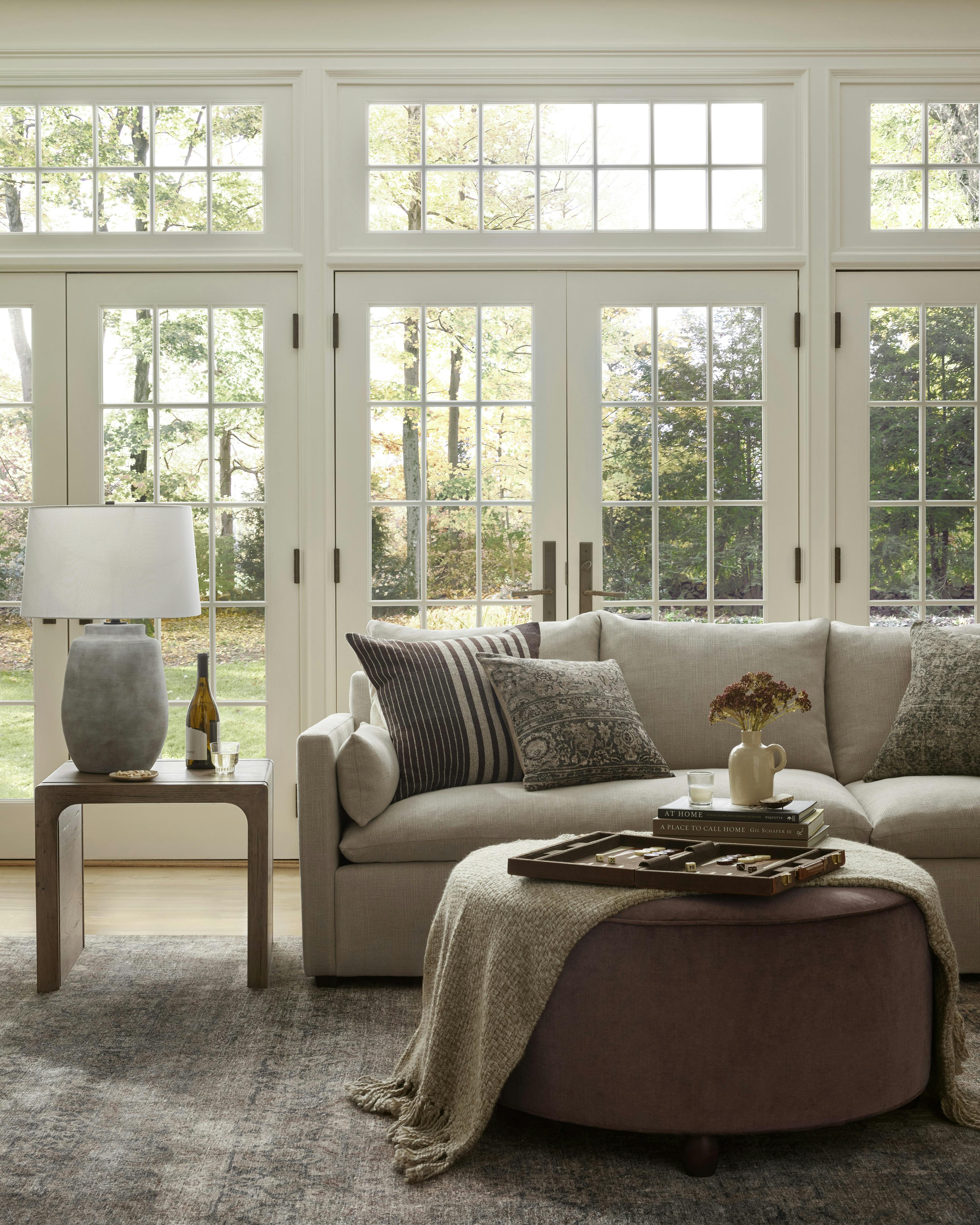 Living room vignette featuring Althea Rug, Brynn Coffee Table and Leighton Sectional