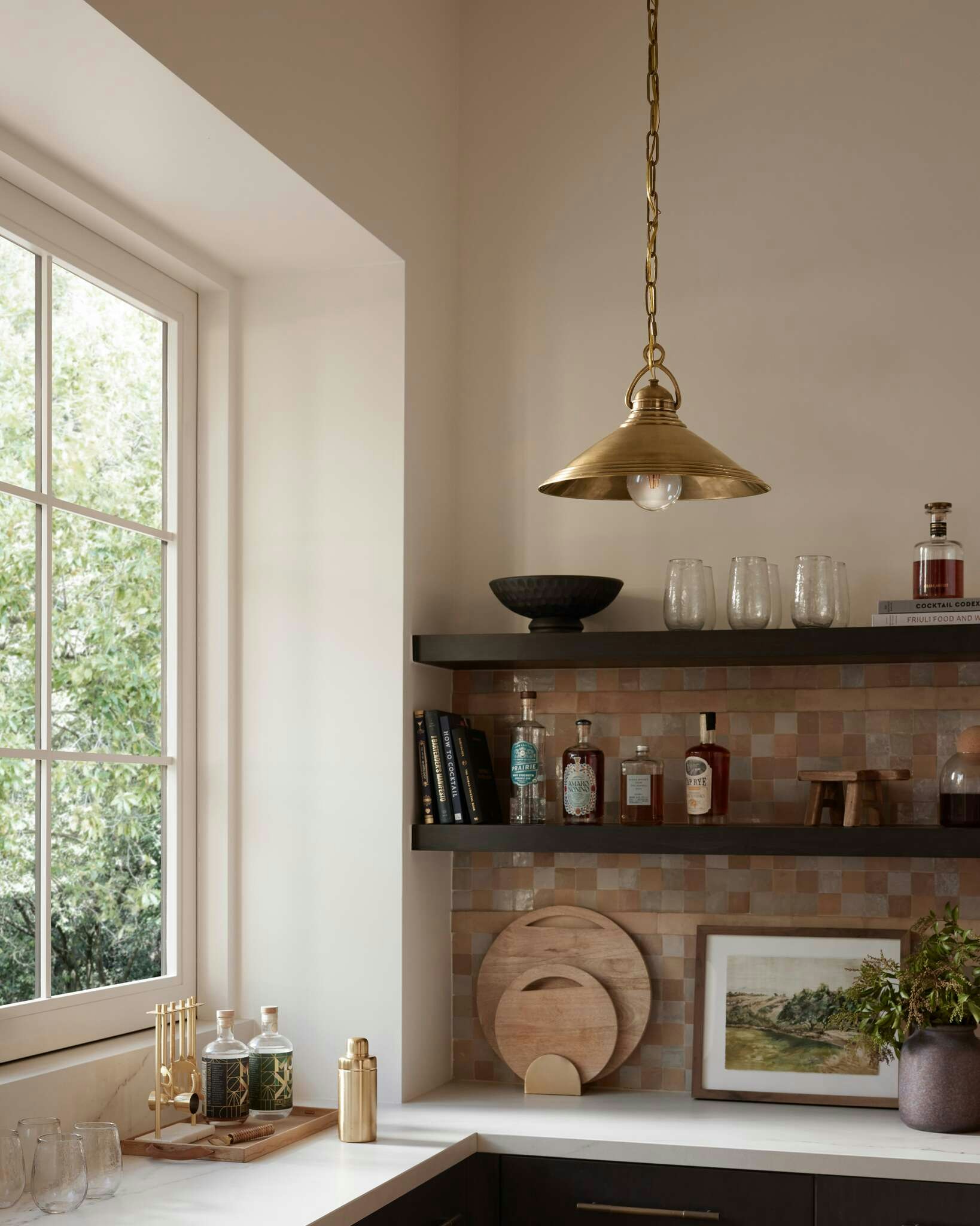 Kitchen countertop featuring Lucienne pendant light and Countryside Scenery Artwork