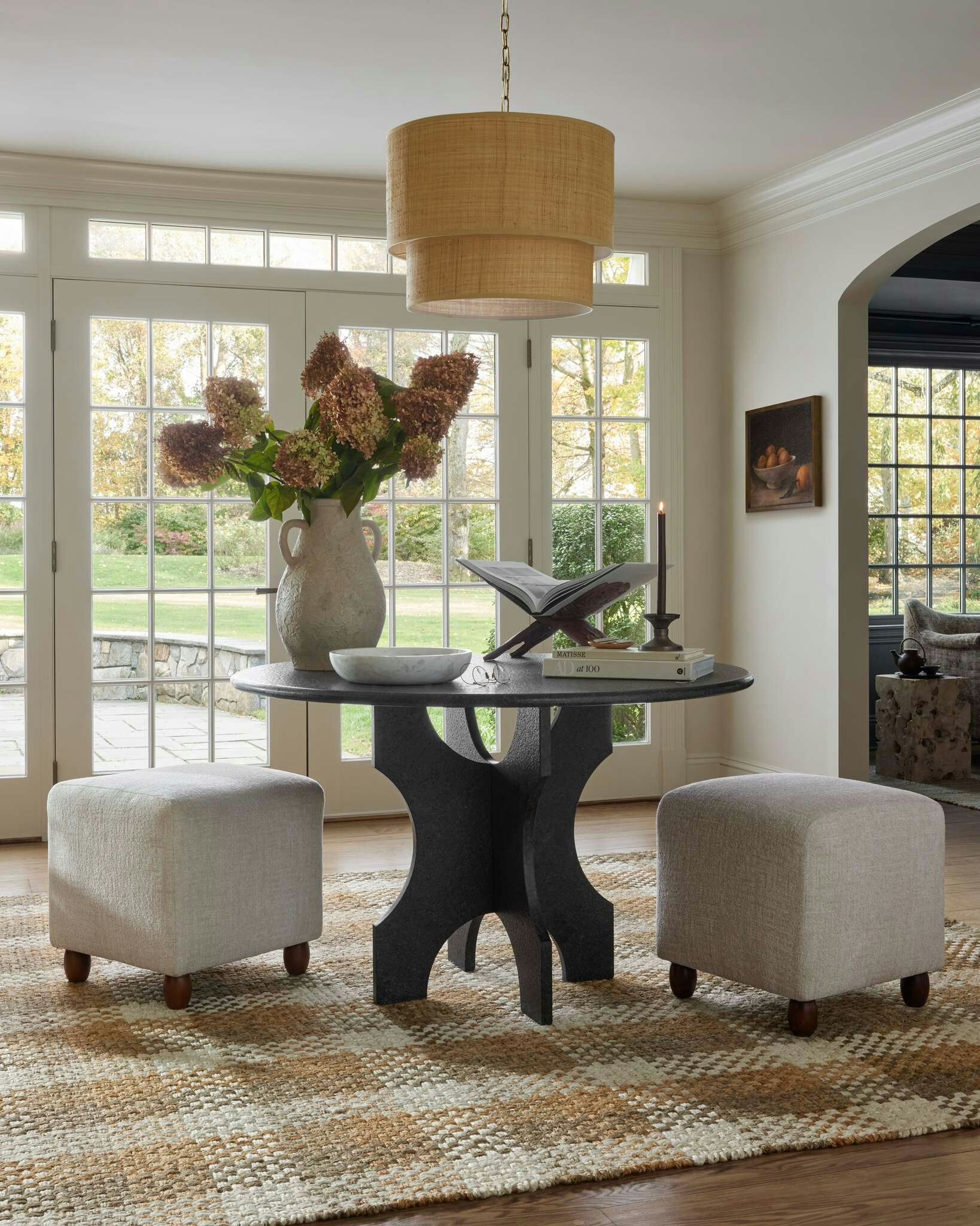Room featuring Fallon Accent Table, Chase Cube Stools and Latika Rug
