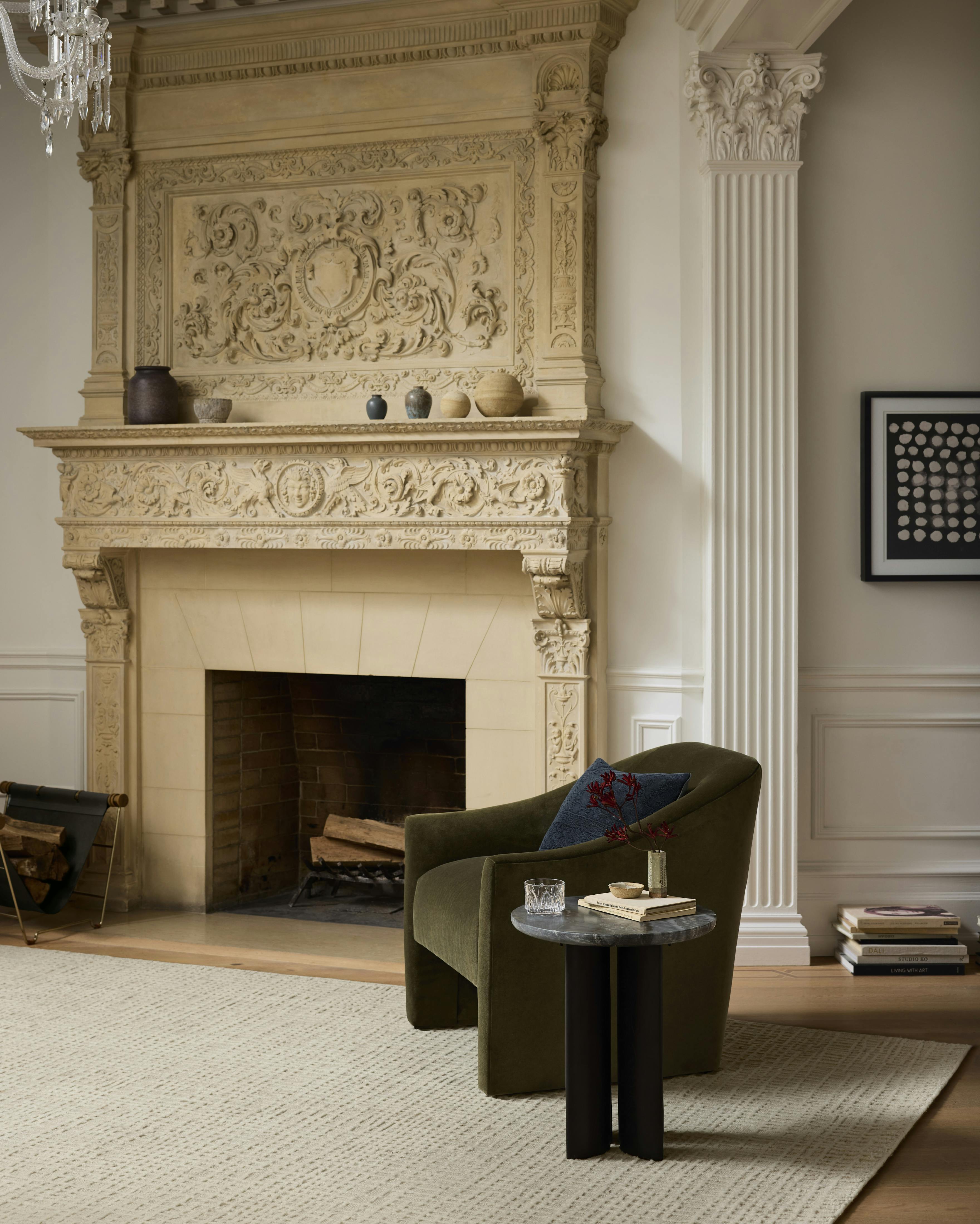 Fireplace and mantel featuring Burton chair