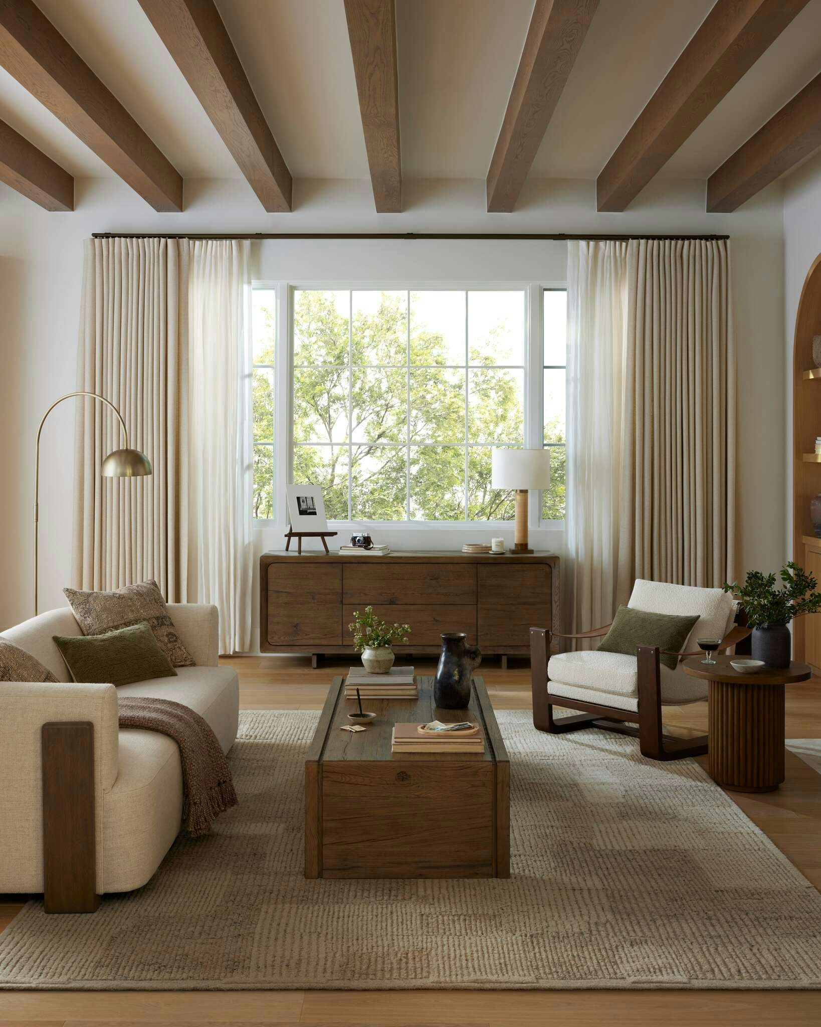 Living room shot featuring Hudson Cradle Sofa, Cassius Sling Chair, Hargrove Coffee Table and Sarita Rug