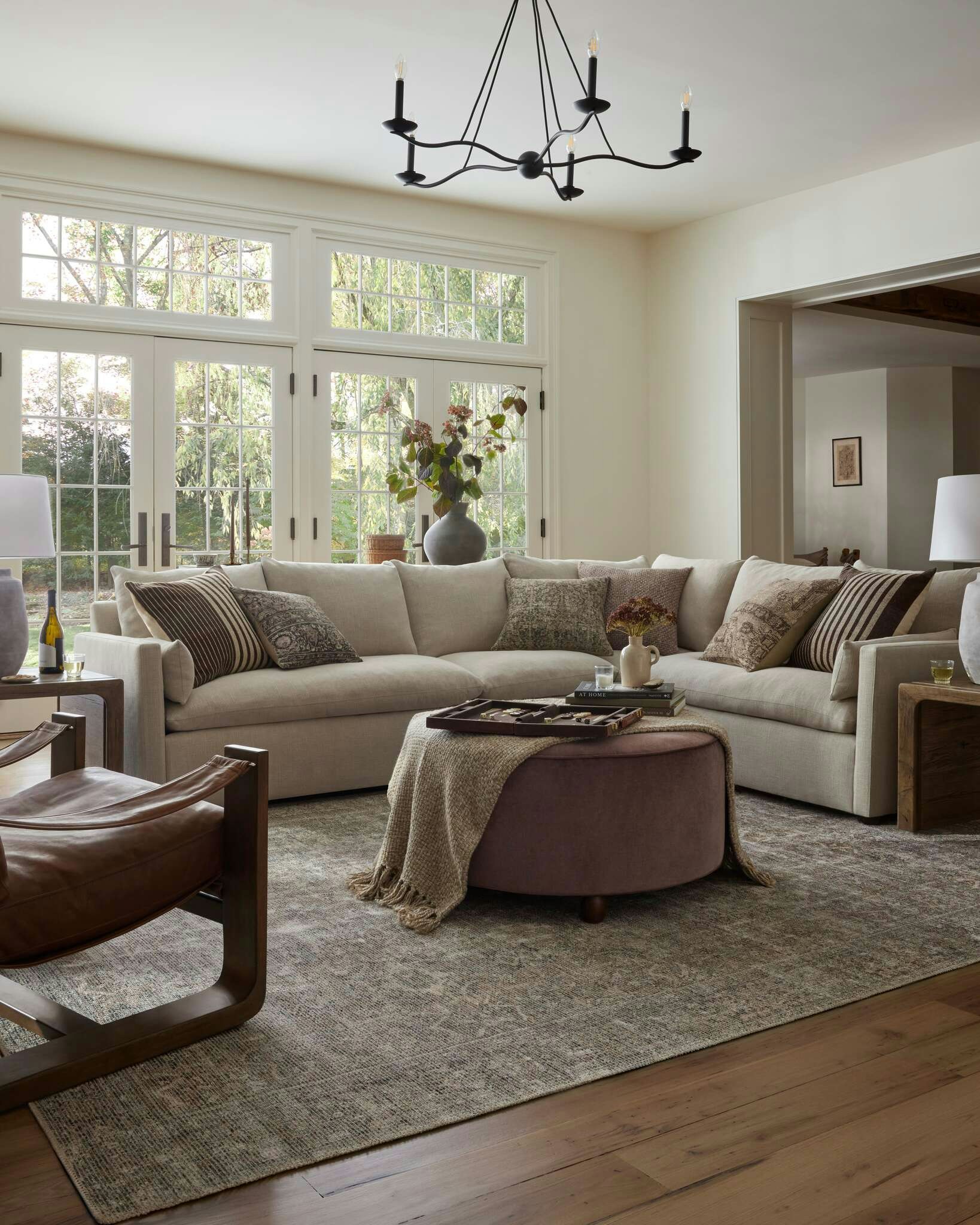 Living Room Featuring Leighton Sectional, Althea Rug and Brynn Ottoman